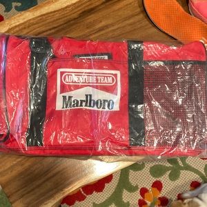 Red Adventure Team duffel bag. New, never used.